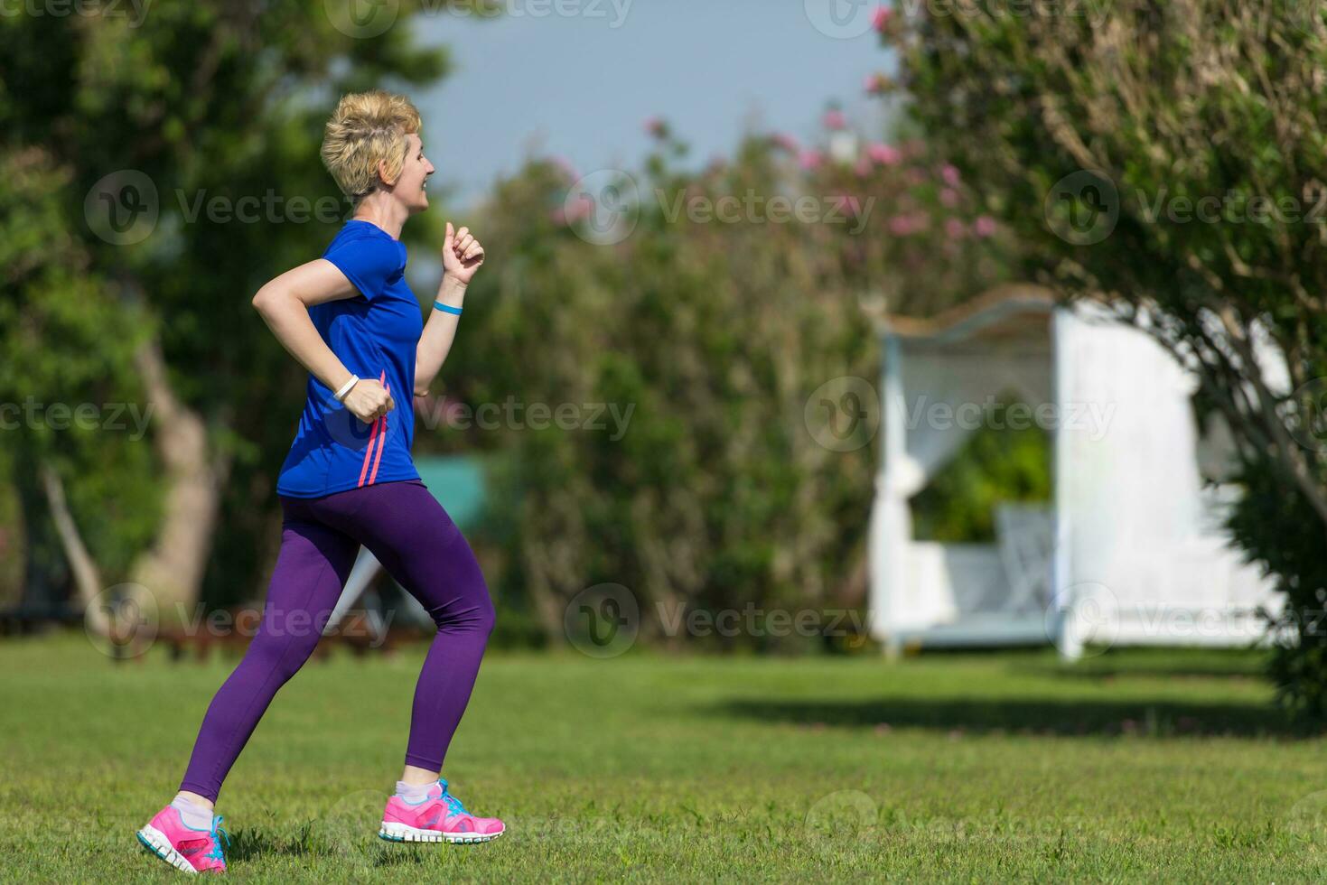 young female runner training for marathon photo