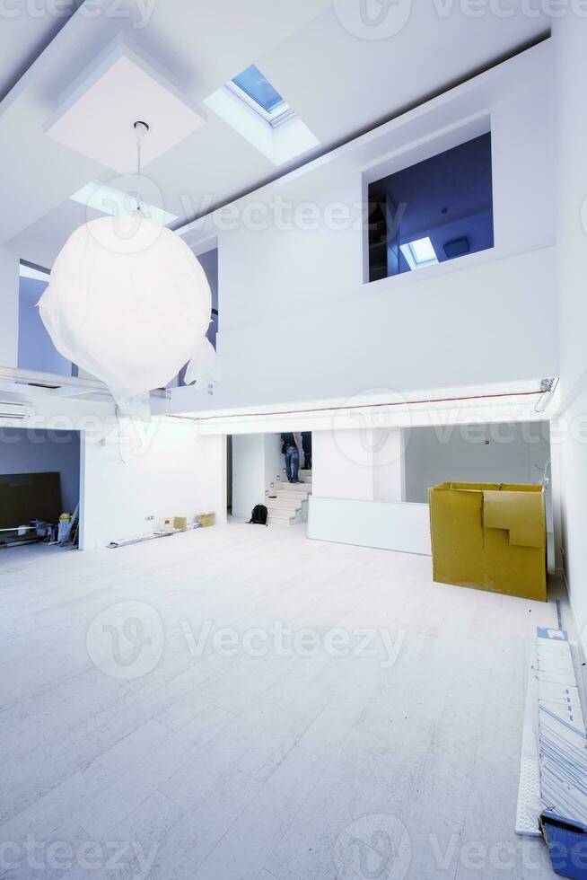 Interior of empty stylish modern open space two level apartment photo