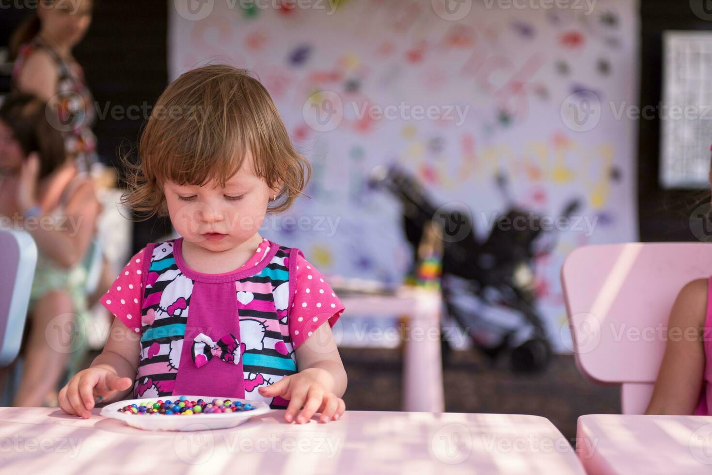 little girl drawing a colorful pictures photo