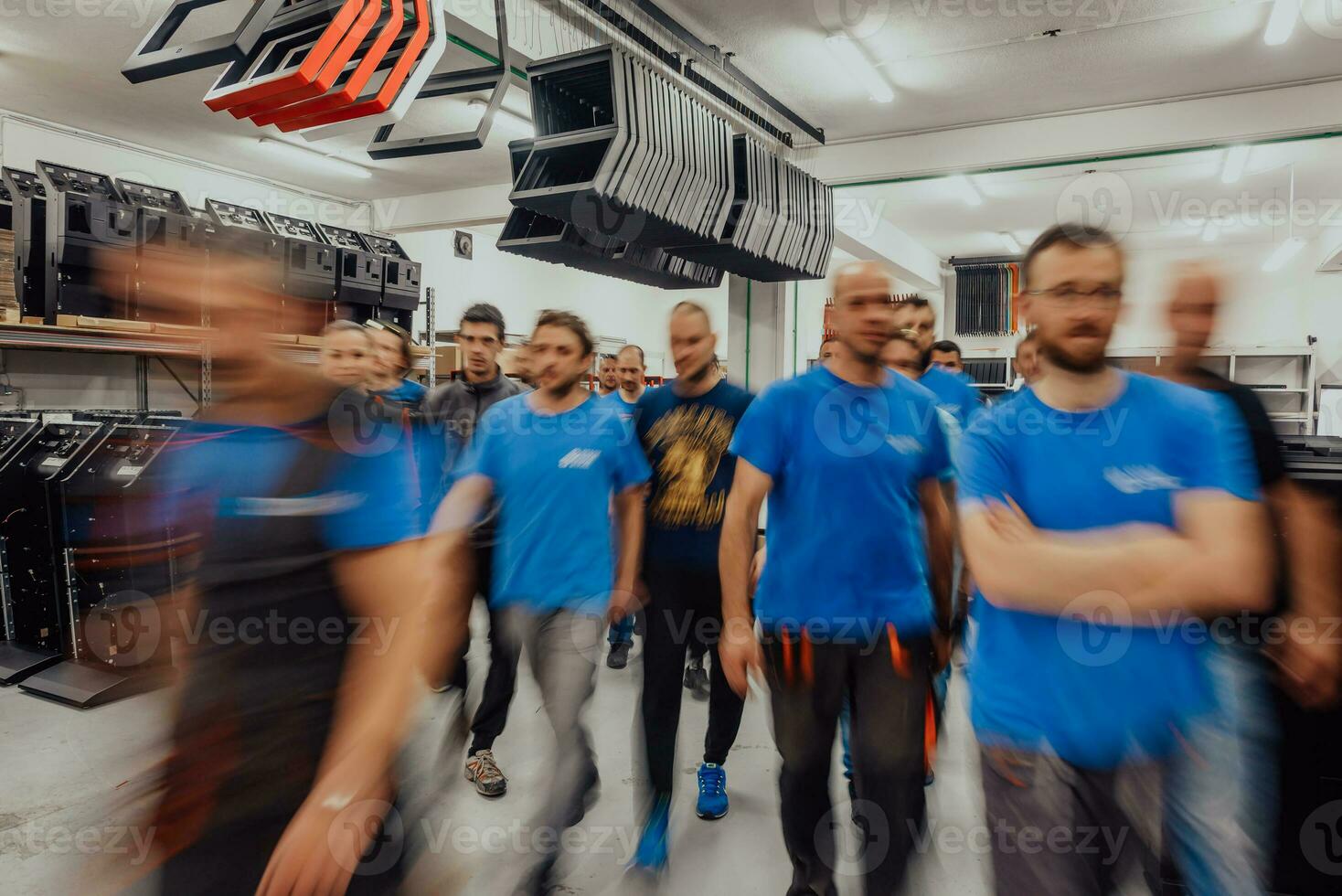 Blurred movement of workers in modern heavy industry while doing the jobs they are in charge of. Blurred photo. Selective focus photo