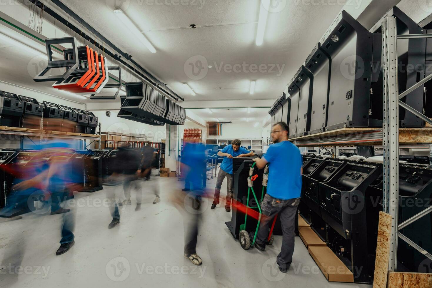 Blurred movement of workers in modern heavy industry while doing the jobs they are in charge of. Blurred photo. Selective focus photo