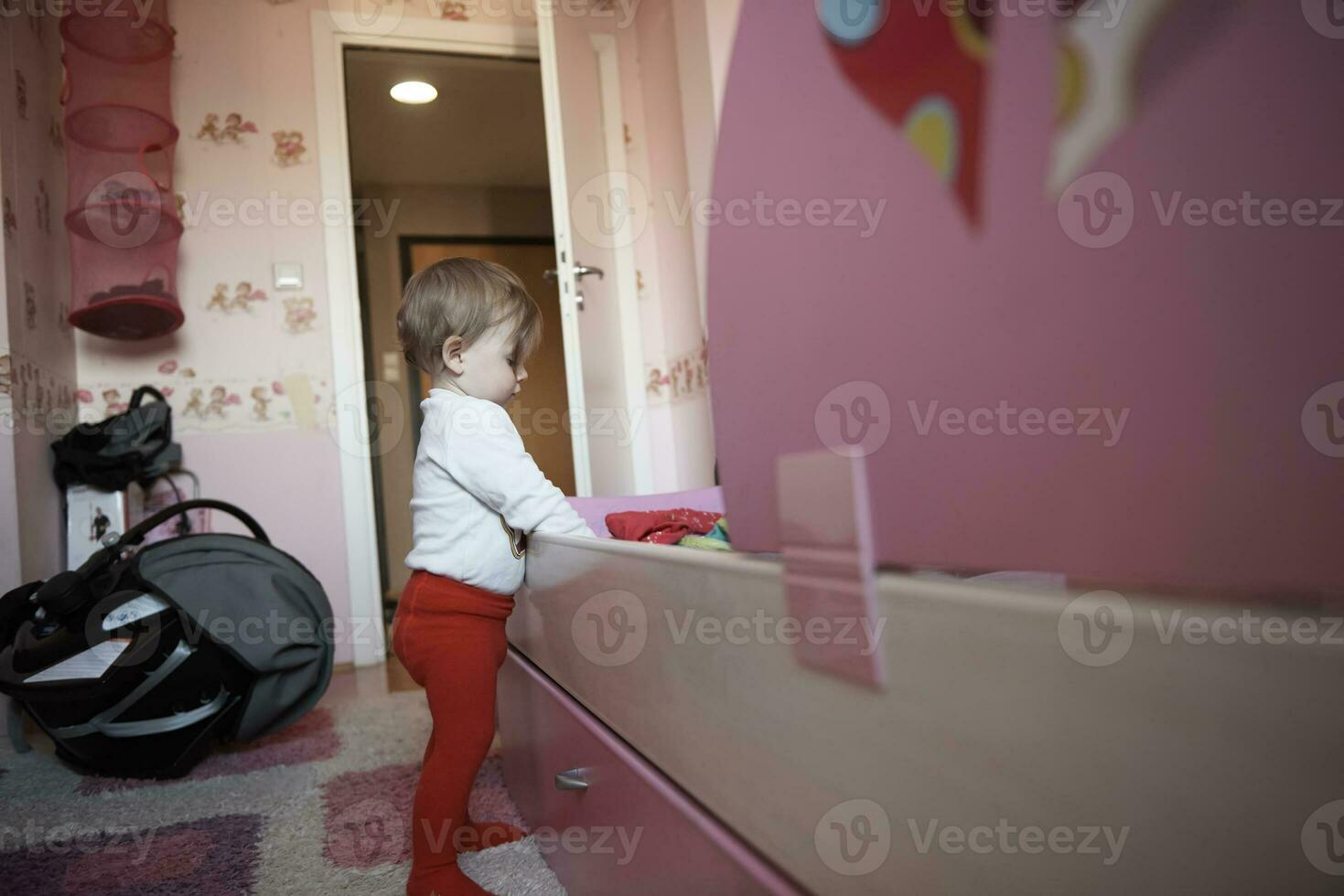 cute  little one year old baby and making first steps photo