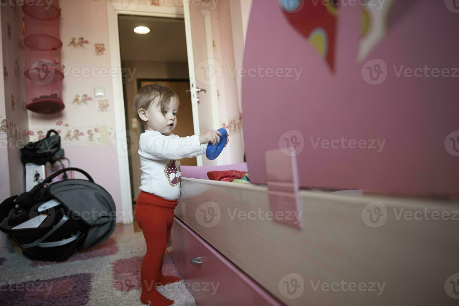 cute  little one year old baby and making first steps photo