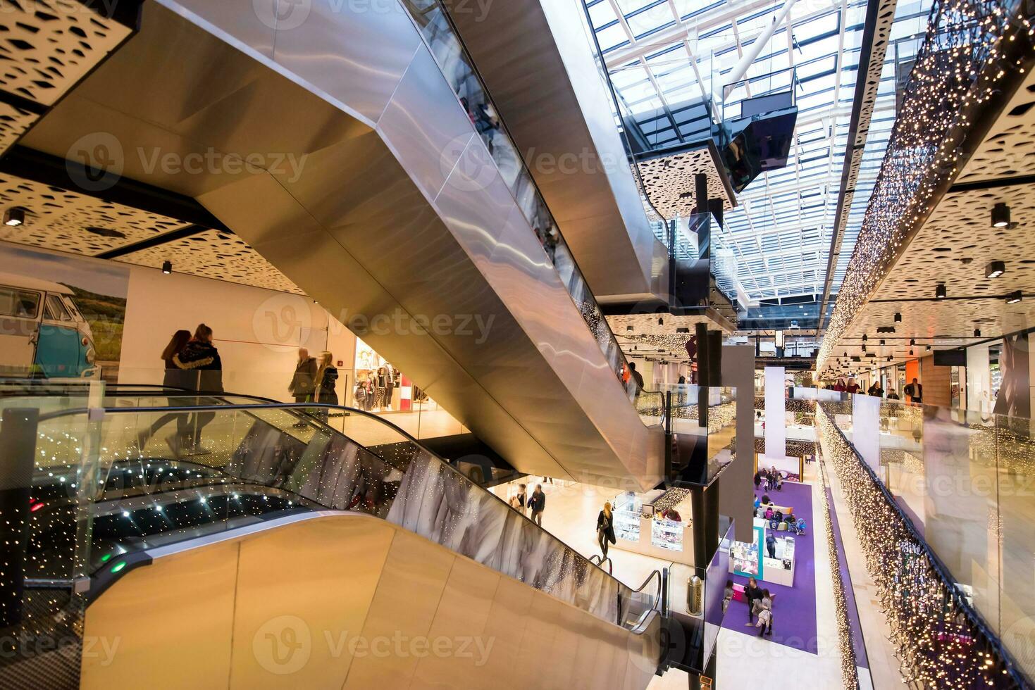 Interior of big modern shopping mall photo