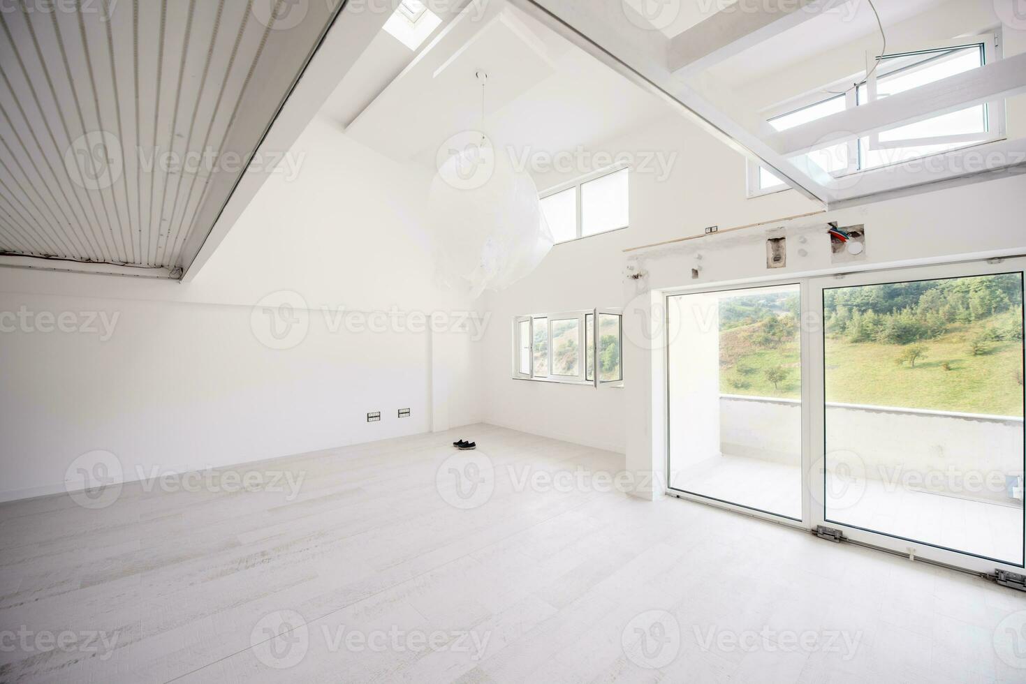 Interior of empty stylish modern open space two level apartment photo