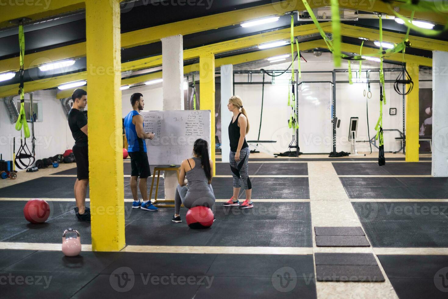 athletes getting instructions from trainer photo
