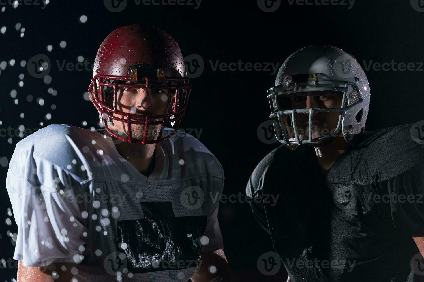 two american football players face to face in silhouette shadow on white background photo