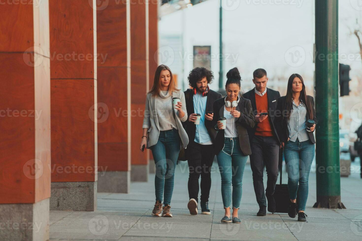 businesspeople group walking in a modern city.. photo