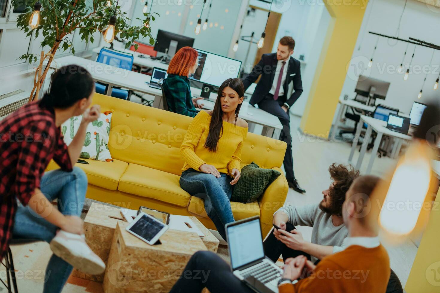 Multiethnic group of employees working in a marketing company. A group of colleagues is working on a project in modern offices photo