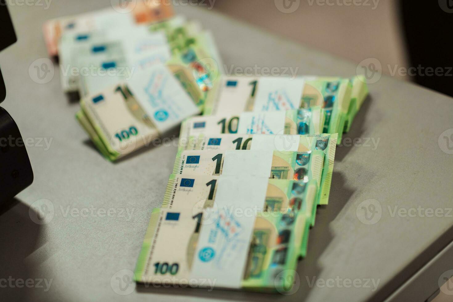 Sorted banknotes placed on the table after it is counted on the electronic money counting machine photo
