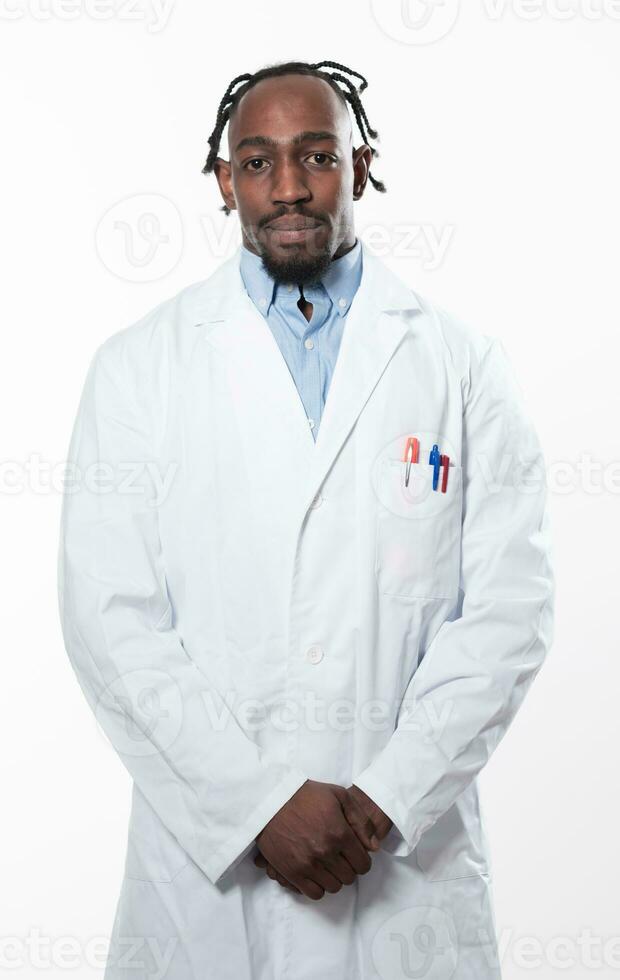Doctor dark skin guy virologist agent corona virus seminar conference arms crossed pandemic virus expert wear white lab coat isolated white color background using a tablet computer. photo