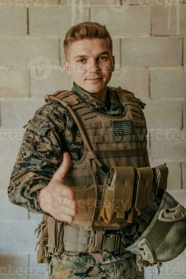 I choose you. A soldier with an outstretched hand towards the camera shows that he chooses you for support and partnership in warfare photo