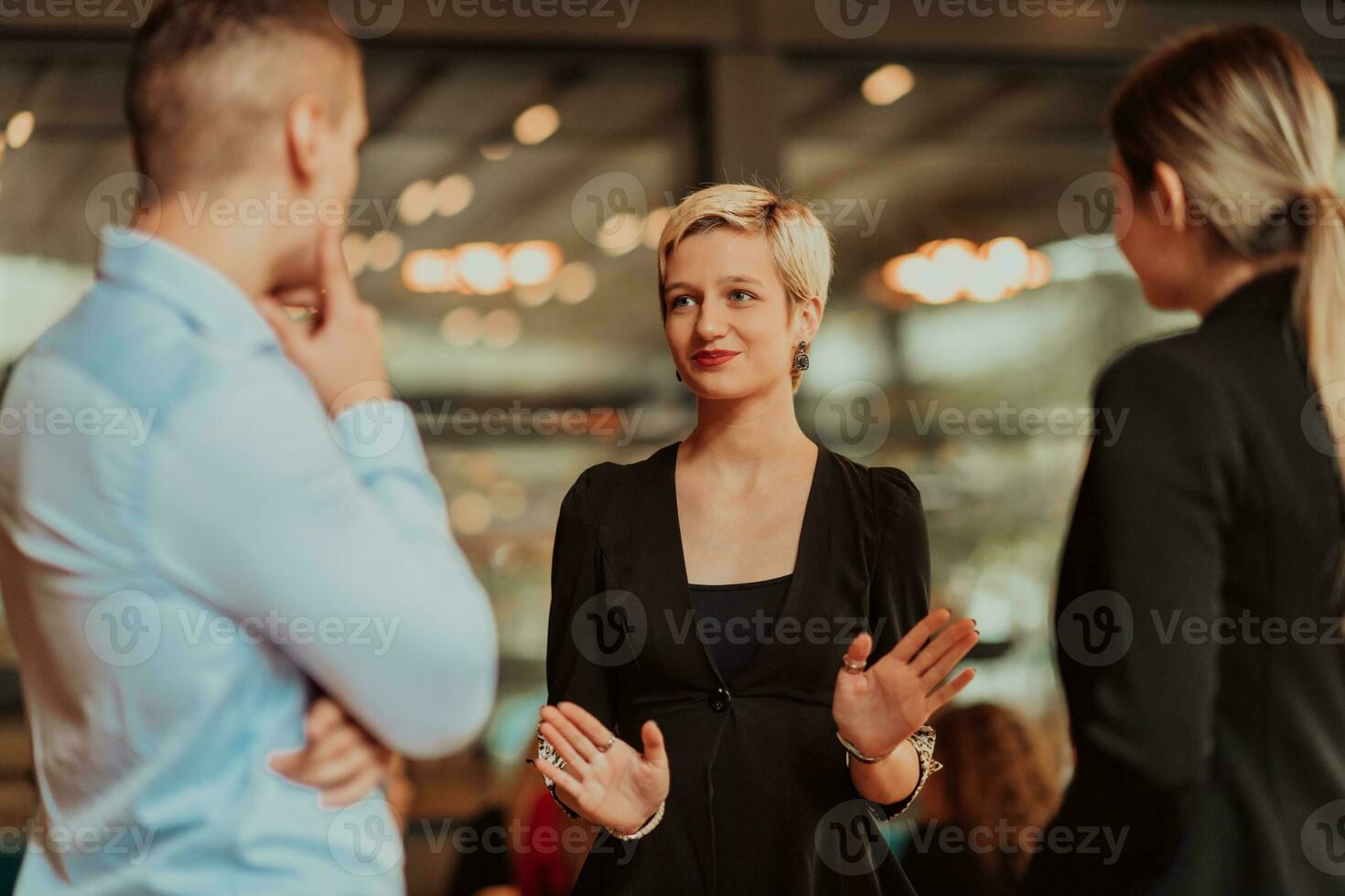 Photo of a business team of young people discussing business ideas in a modern urban environment. Selective focus