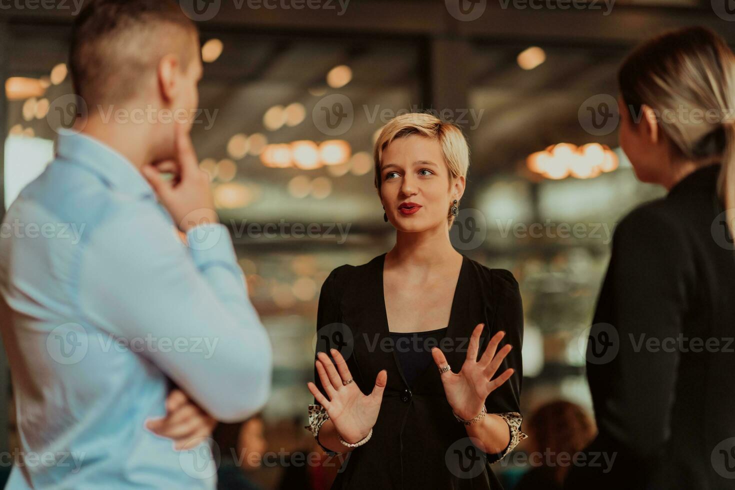 Photo of a business team of young people discussing business ideas in a modern urban environment. Selective focus
