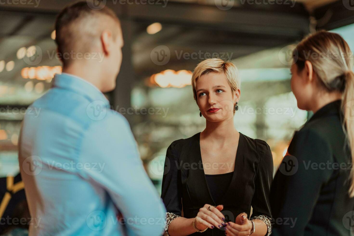 Photo of a business team of young people discussing business ideas in a modern urban environment. Selective focus