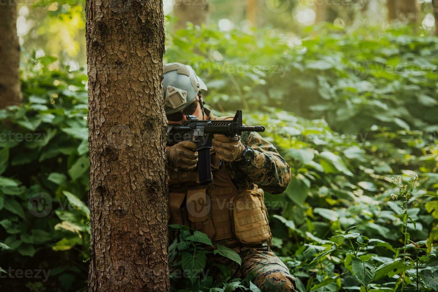 A modern warfare soldier on war duty in dense and dangerous forest areas. Dangerous military rescue operations photo