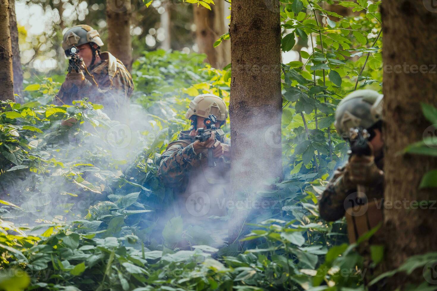 A group of modern warfare soldiers is fighting a war in dangerous remote forest areas. A group of soldiers is fighting on the enemy line with modern weapons. The concept of warfare and military conflicts photo