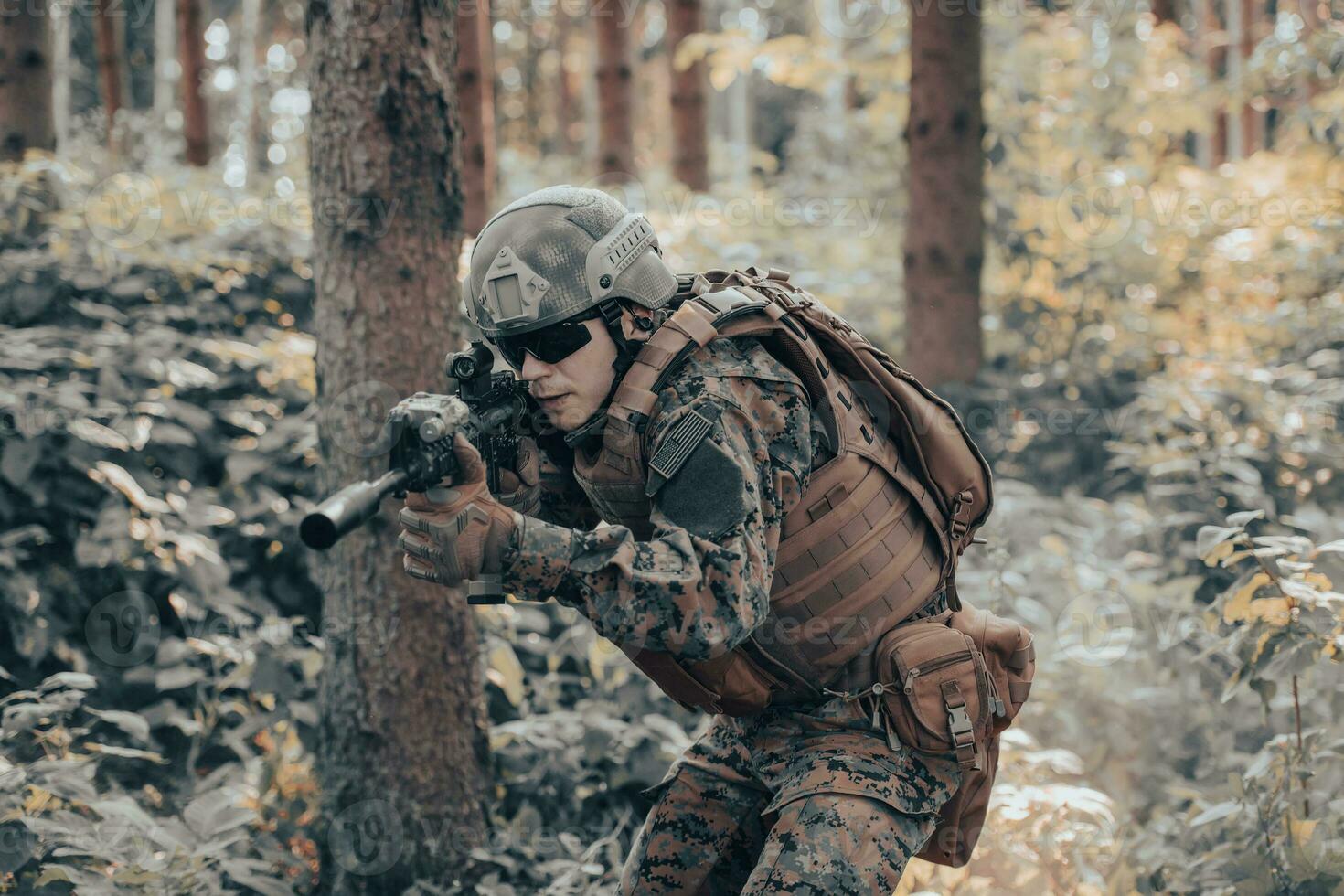 A modern warfare soldier on war duty in dense and dangerous forest areas. Dangerous military rescue operations photo