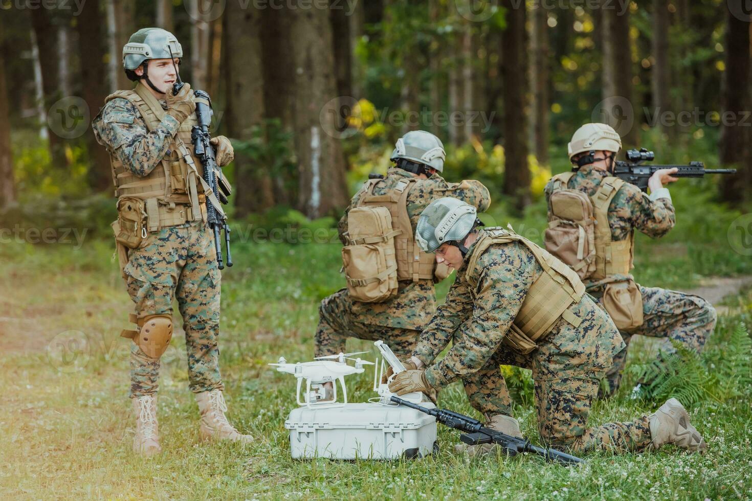 Modern Warfare Soldiers Squad are Using Drone for Scouting and Surveillance During Military Operation in the Forest. photo