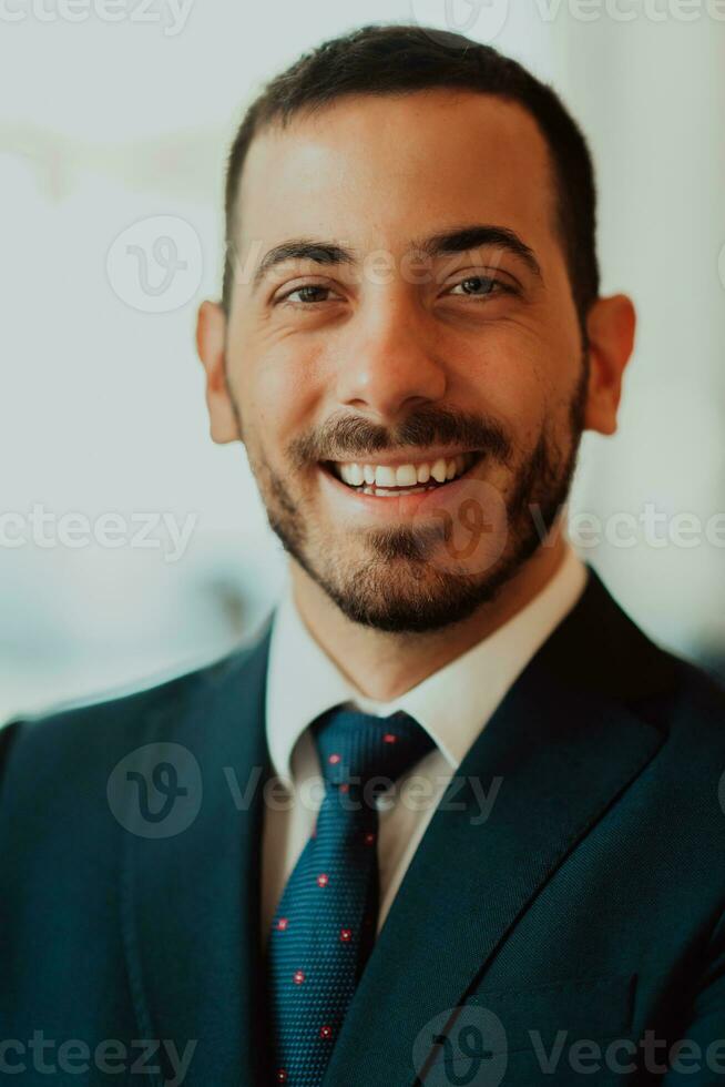 Portrait of a businessman in a suit in a modern office building. Selective focus photo
