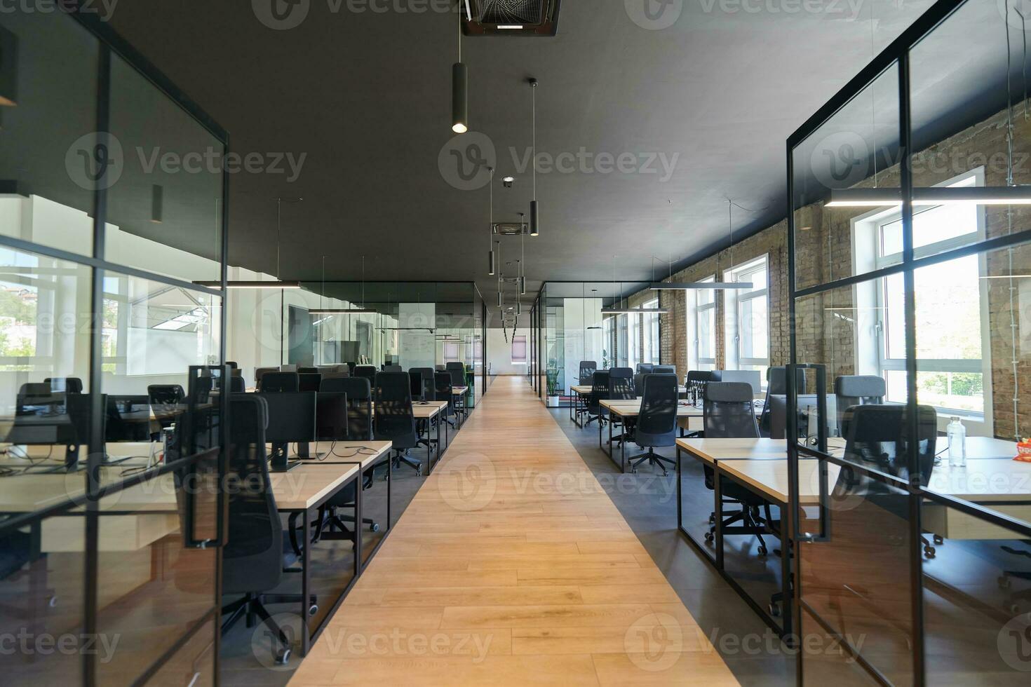 In a setting of modern, glass-walled business startup offices, the open, airy workspace reflects a contemporary and innovative ambiance, promising a dynamic environment for entrepreneurial growth photo