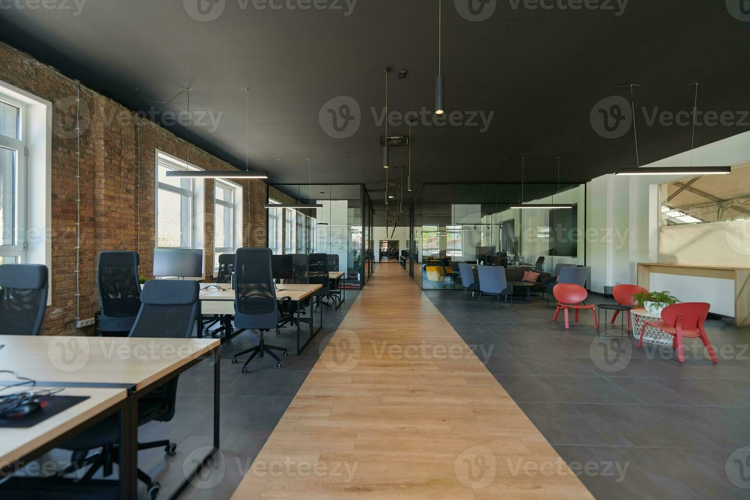 In a setting of modern, glass-walled business startup offices, the open, airy workspace reflects a contemporary and innovative ambiance, promising a dynamic environment for entrepreneurial growth photo