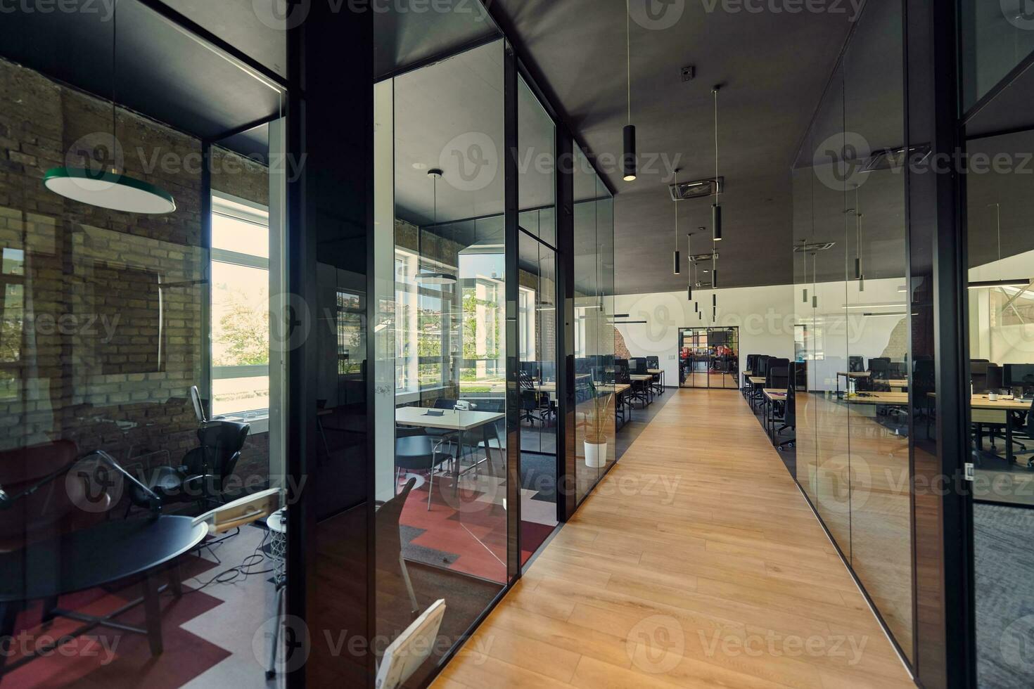 In a setting of modern, glass-walled business startup offices, the open, airy workspace reflects a contemporary and innovative ambiance, promising a dynamic environment for entrepreneurial growth photo