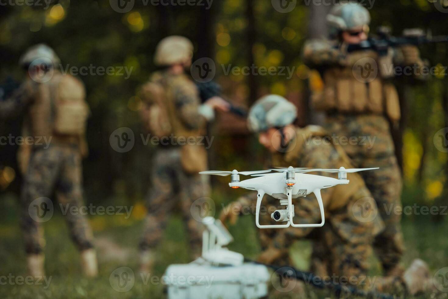 Modern Warfare Soldiers Squad are Using Drone for Scouting and Surveillance During Military Operation in the Forest. photo