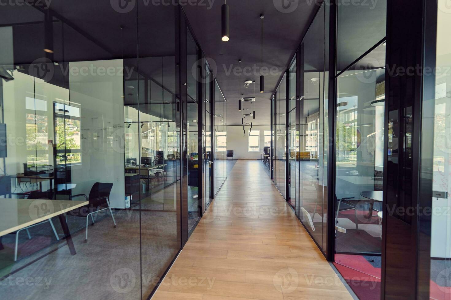 In a setting of modern, glass-walled business startup offices, the open, airy workspace reflects a contemporary and innovative ambiance, promising a dynamic environment for entrepreneurial growth photo