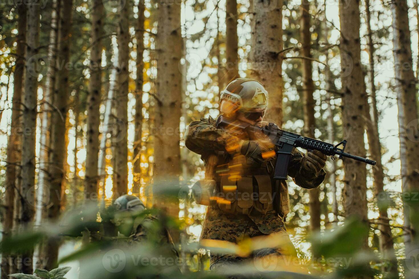 A modern warfare soldier on war duty in dense and dangerous forest areas. Dangerous military rescue operations photo