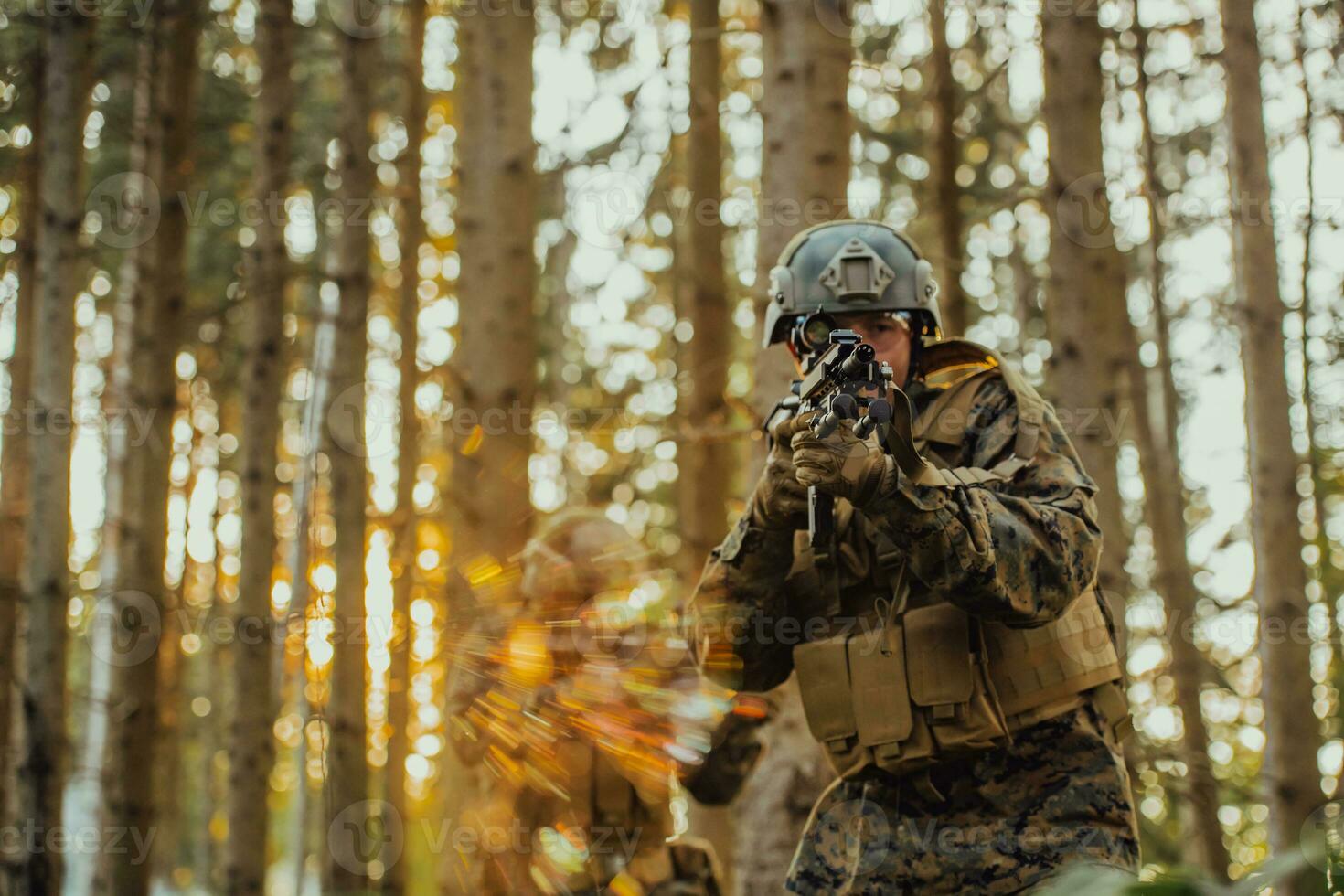 A modern warfare soldier on war duty in dense and dangerous forest areas. Dangerous military rescue operations photo