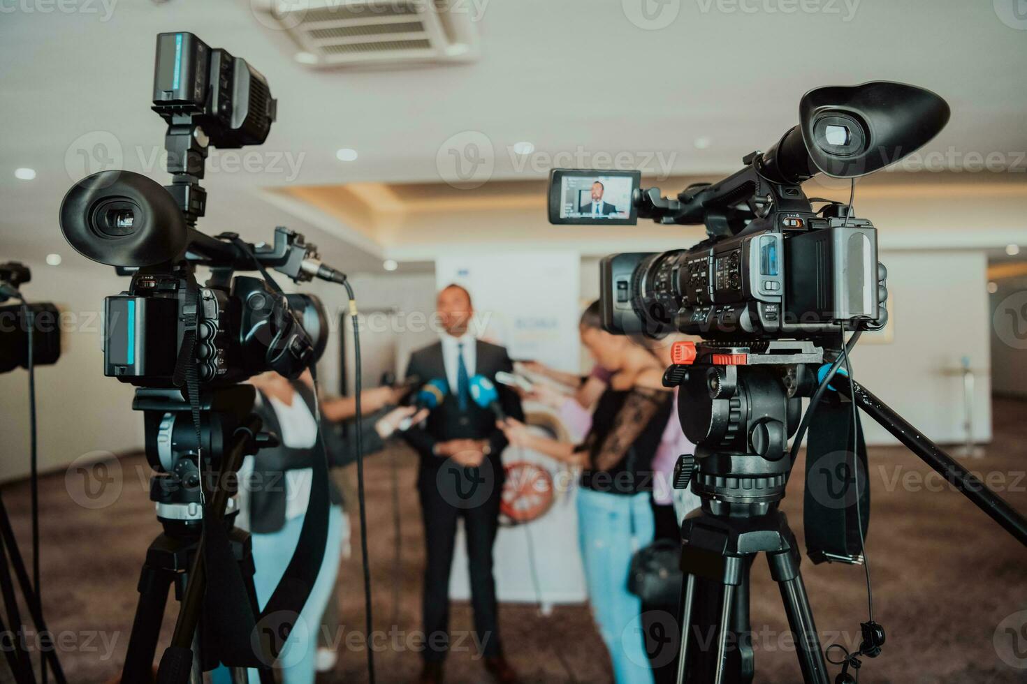 professional video production camera recording live event on stage. television social media broadcasting seminar conference. photo