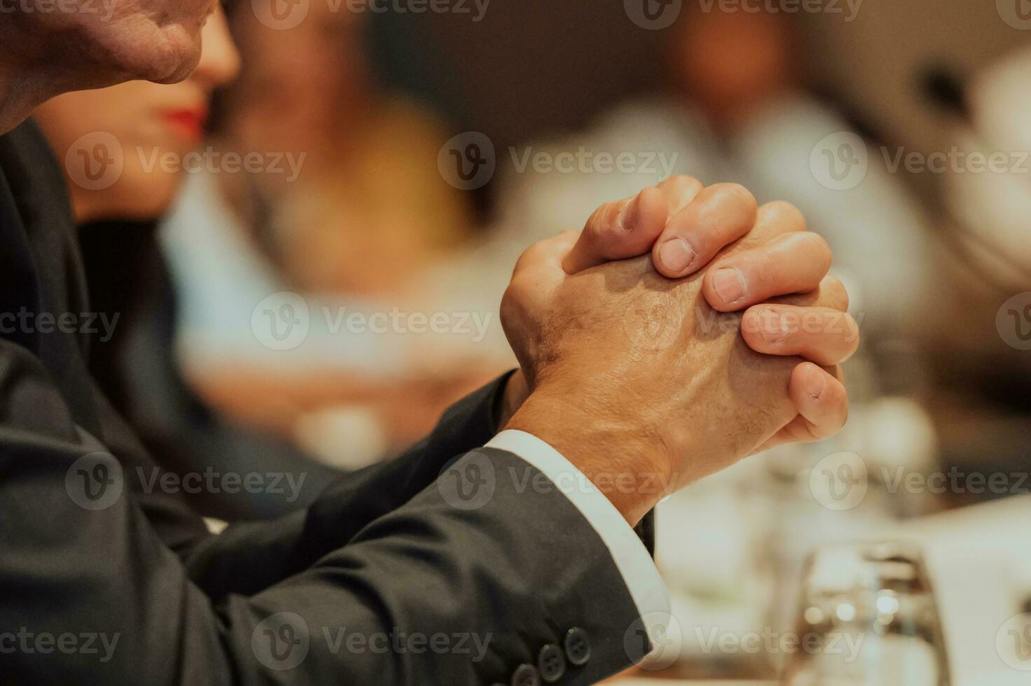 Close-up photo of businessmen who are at a meeting and business meeting in a modern hall