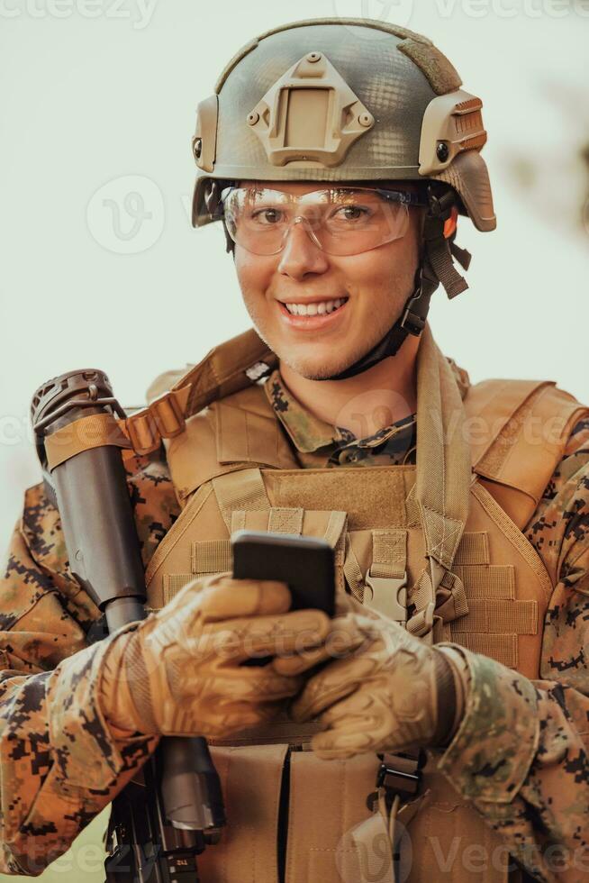 Soldier using smartphone to contact family or girlfriend communication and nostalgia concept photo