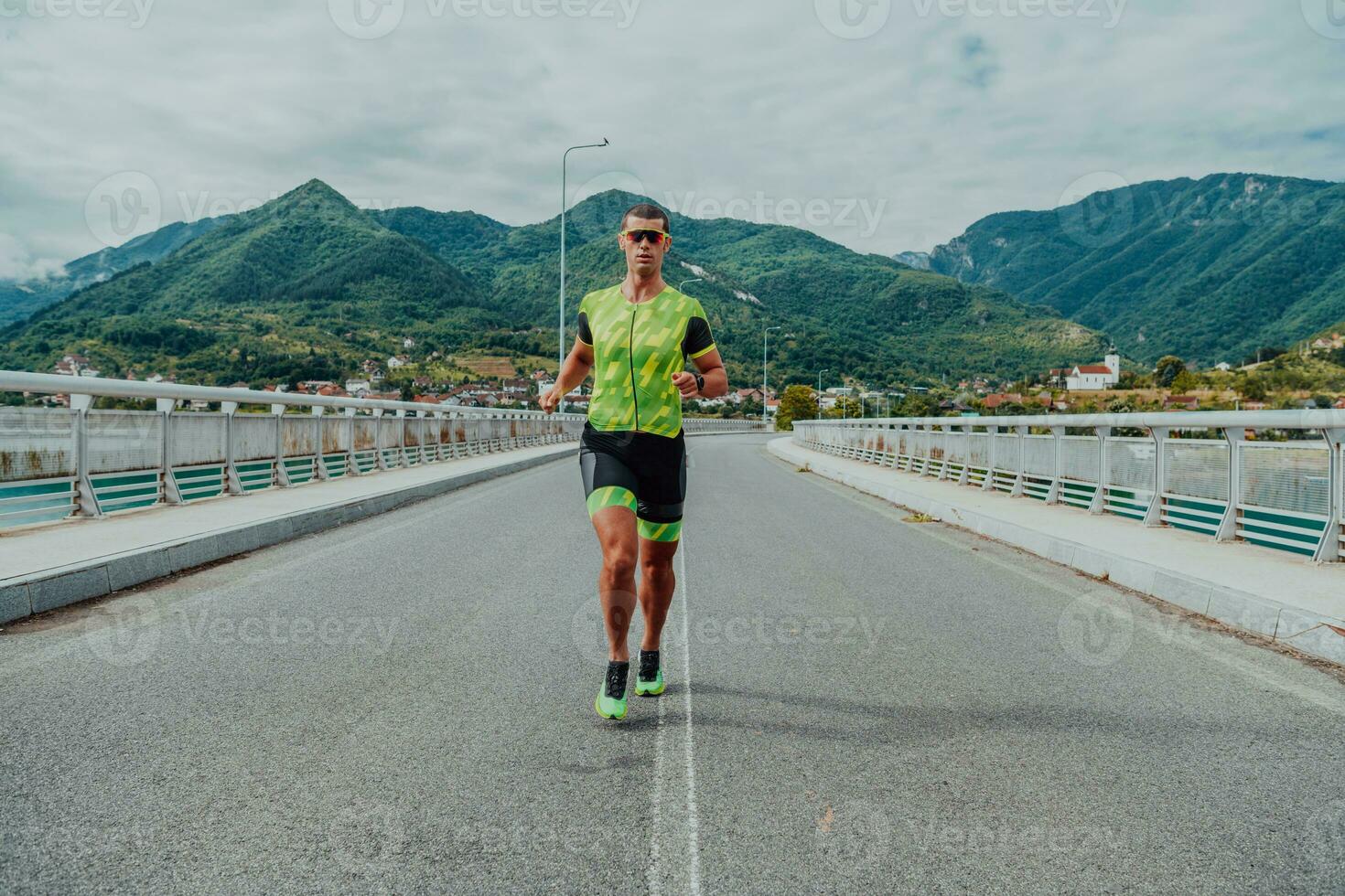 An athlete running a marathon and preparing for his competition. Photo of a marathon runner running in an urban environment