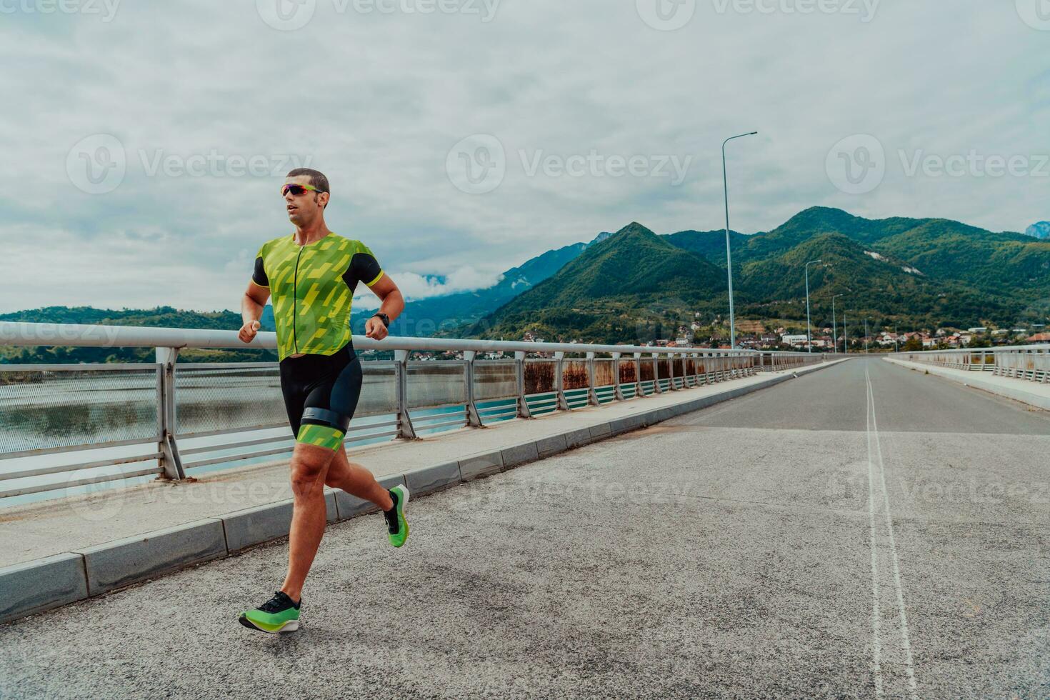 An athlete running a marathon and preparing for his competition. Photo of a marathon runner running in an urban environment