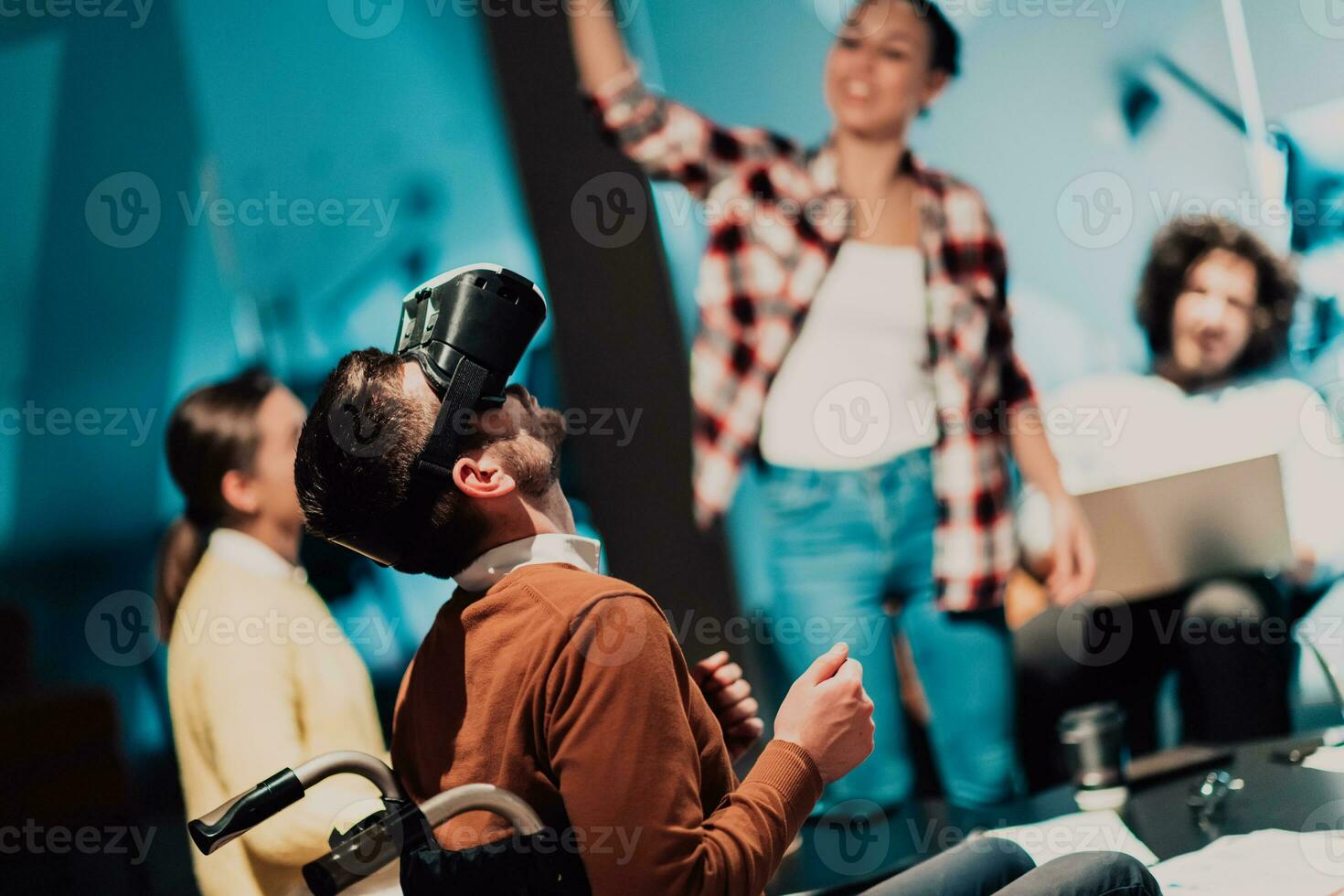 Business persons with a disability at work in modern open space coworking office on team meeting using virtual reality goggles. photo