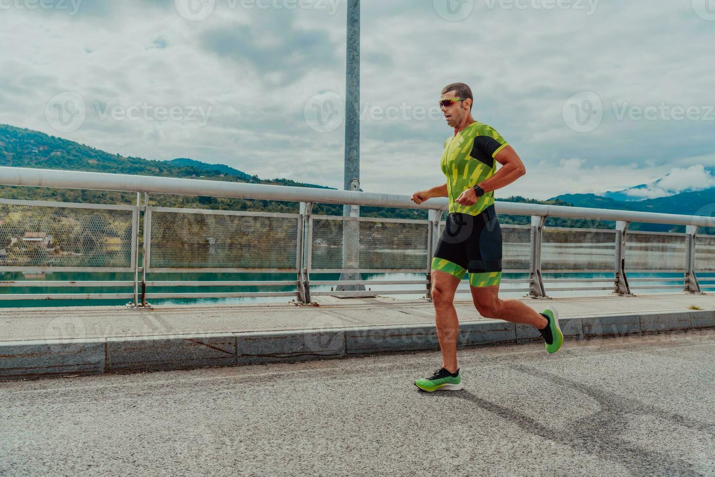 An athlete running a marathon and preparing for his competition. Photo of a marathon runner running in an urban environment