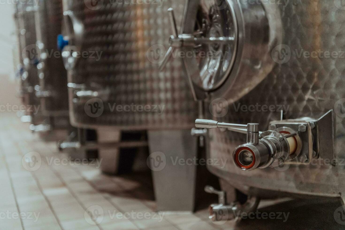 Modern wine distillery and brewery with brew kettles pipes and stainless steel tanks photo