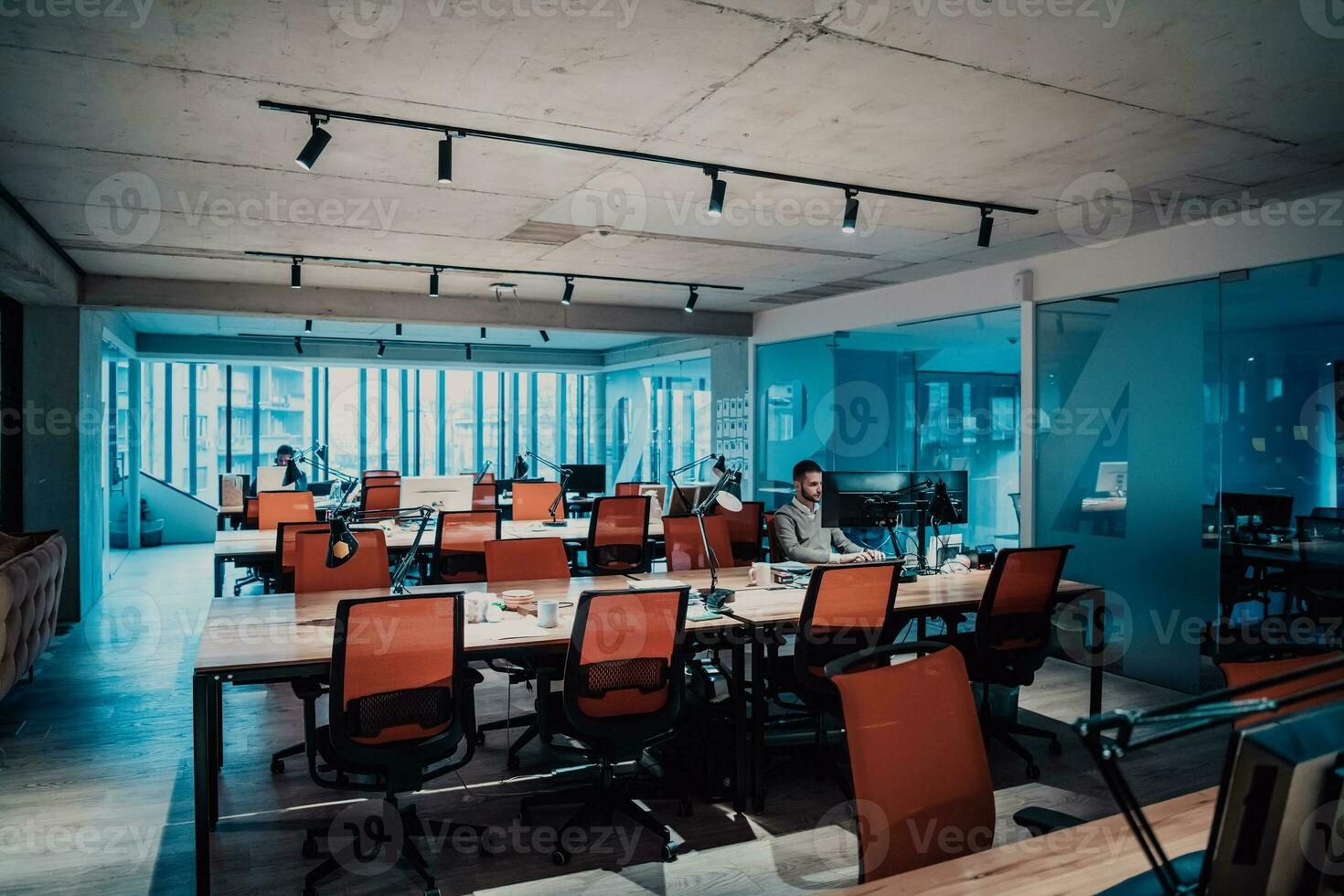 Modern Office Portrait of Stylish Businessman Works on Computer, Does Data Analysis and Creative Designer, Looks at Camera and Smiles. Digital Entrepreneur Works on e-Commerce Startup Project photo