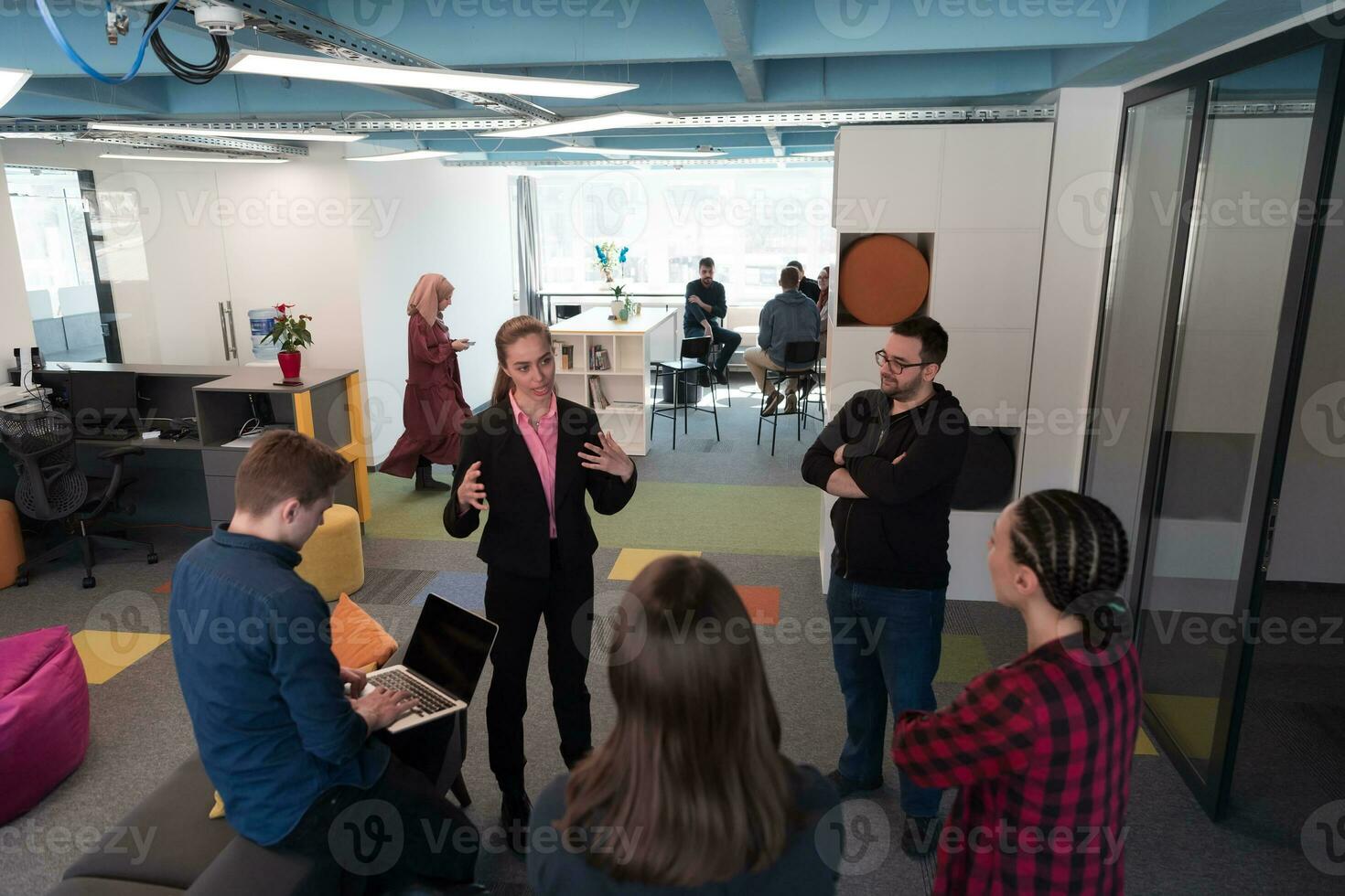 Top view photo of collaborative process of multicultural skilled young business team during brainstorming meeting in office.Diverse group of young people dressed in formal wear cooperating on developing design project