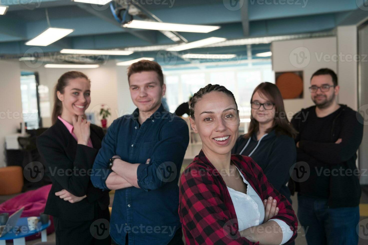 Businesspeople, rivalry and people concept - businesswoman and businessman arm wrestling during corporate meeting in modern bright open space coworking startup business office. photo