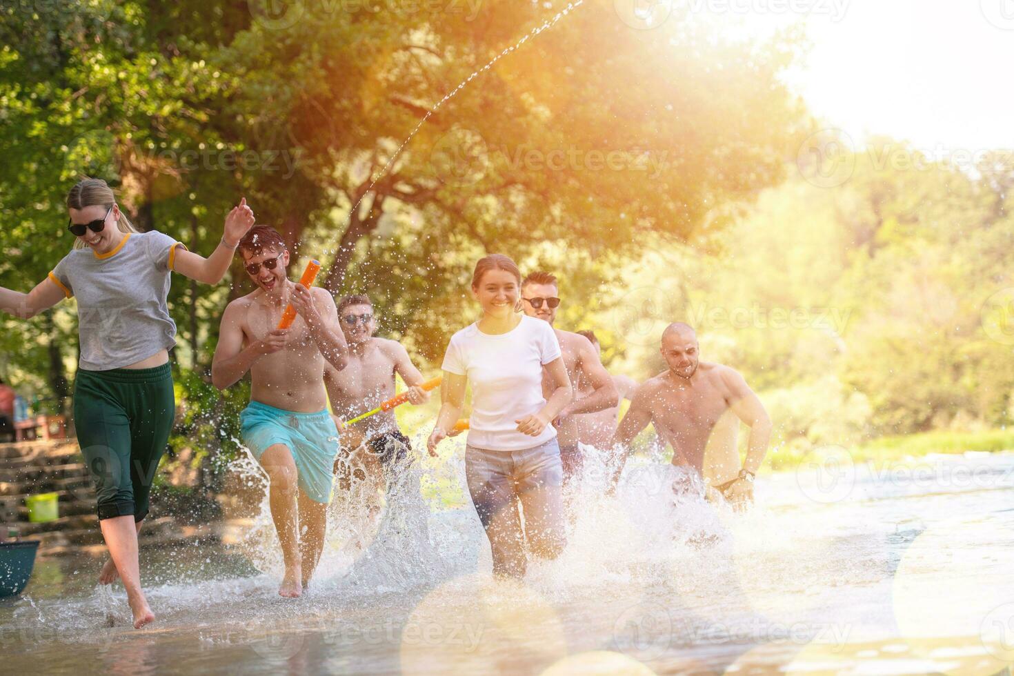 summer joy friends having fun on river photo