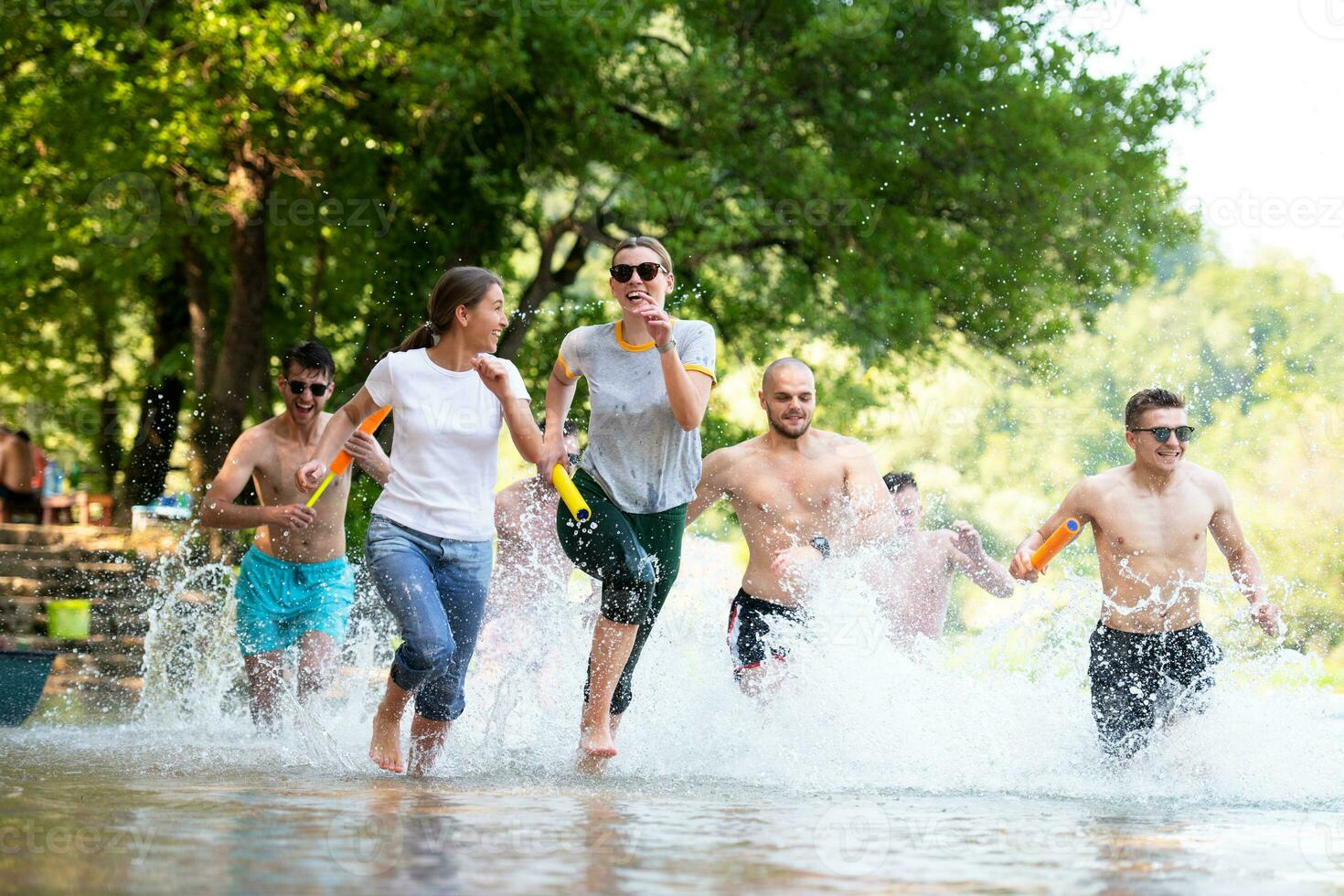 summer joy friends having fun on river photo