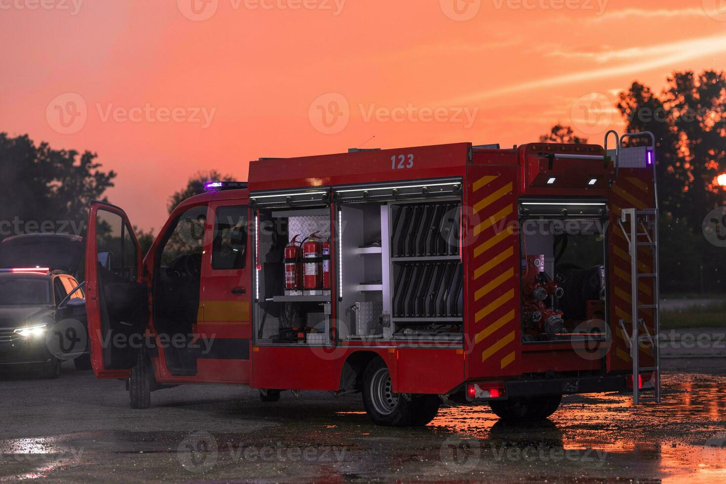 Fire truck emergency vehicle. Firefighting apparatus and water to save lives, suppress wildfire, extinguish building fires and assist vehicle collisions or traffic car crash accidents. photo