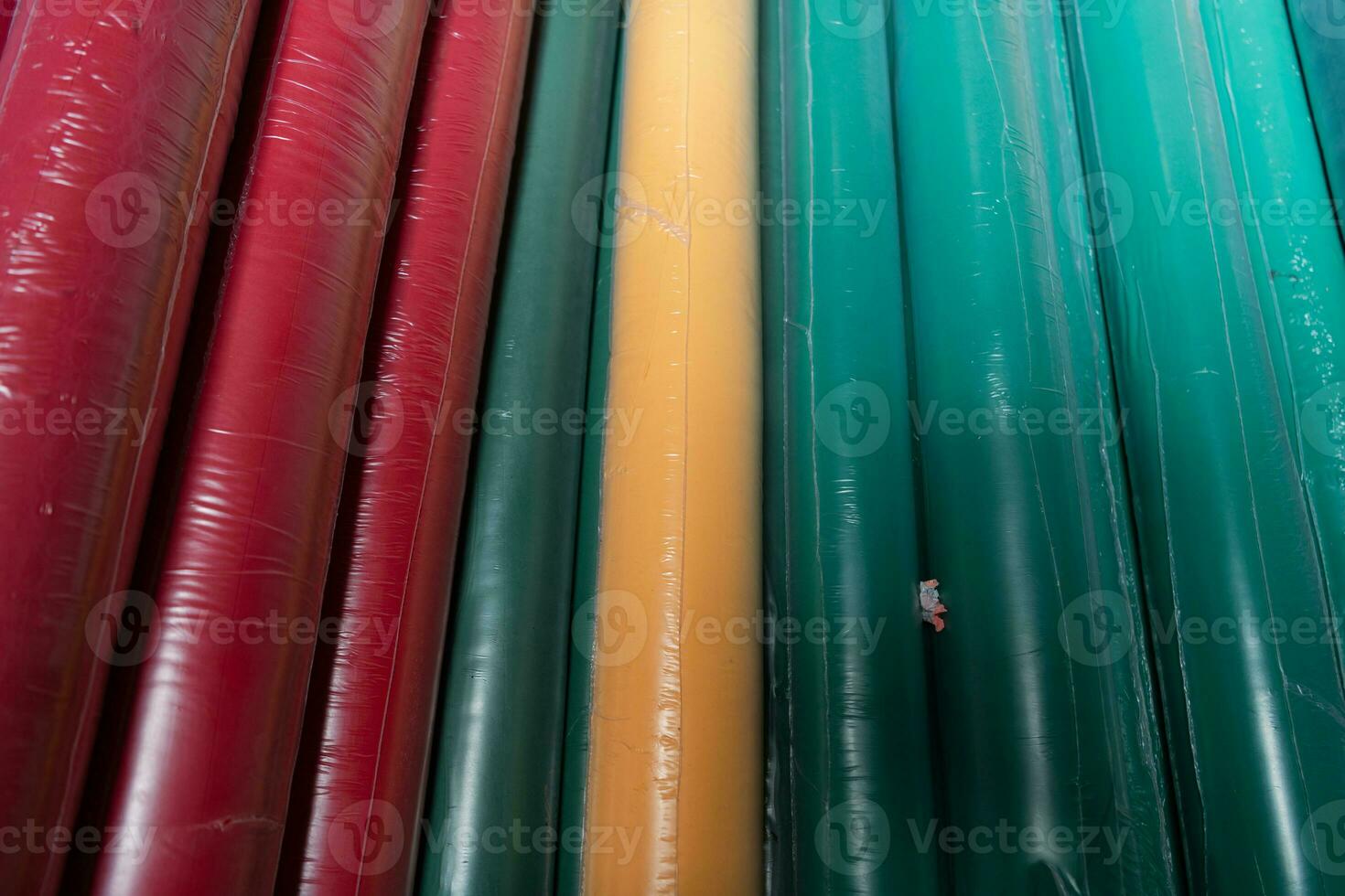 Collection of fashionable fabrics. Samples of different natural fabrics for sewing a fashion collection of clothes. Large selection of fabrics in the store or tailor warehouse. photo