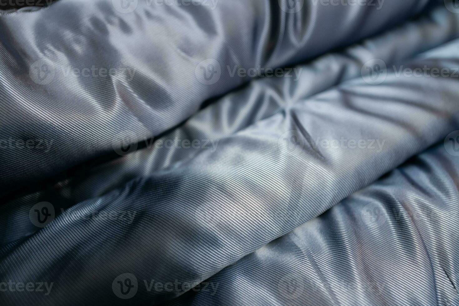 Collection of fashionable fabrics. Samples of different natural fabrics for sewing a fashion collection of clothes. Large selection of fabrics in the store or tailor warehouse. photo