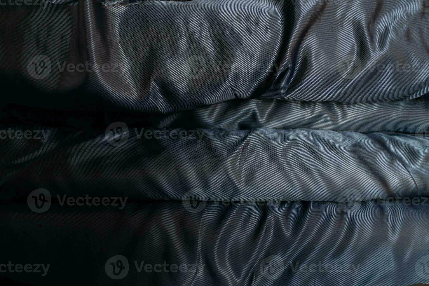 Collection of fashionable fabrics. Samples of different natural fabrics for sewing a fashion collection of clothes. Large selection of fabrics in the store or tailor warehouse. photo