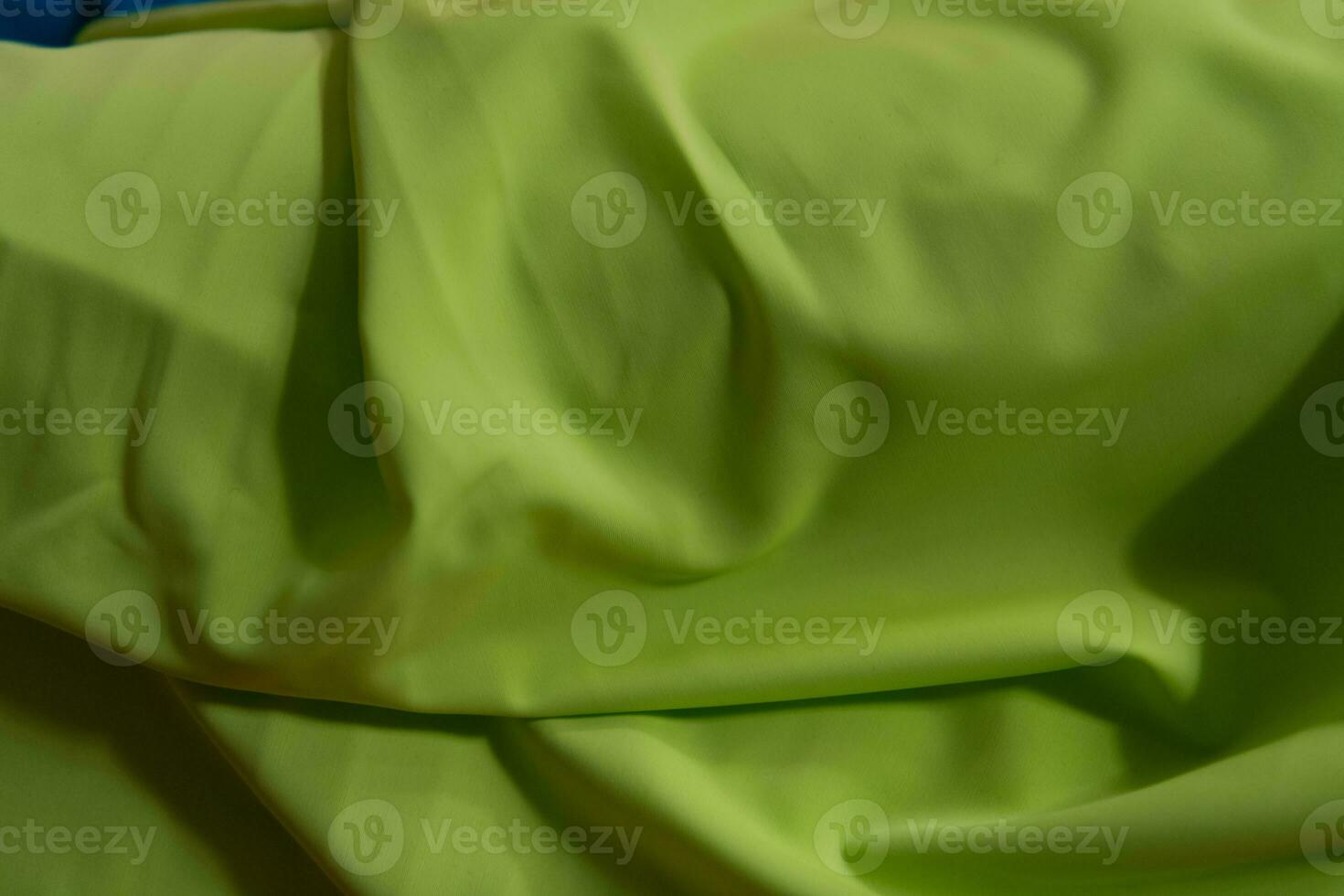 Collection of fashionable fabrics. Samples of different natural fabrics for sewing a fashion collection of clothes. Large selection of fabrics in the store or tailor warehouse. photo