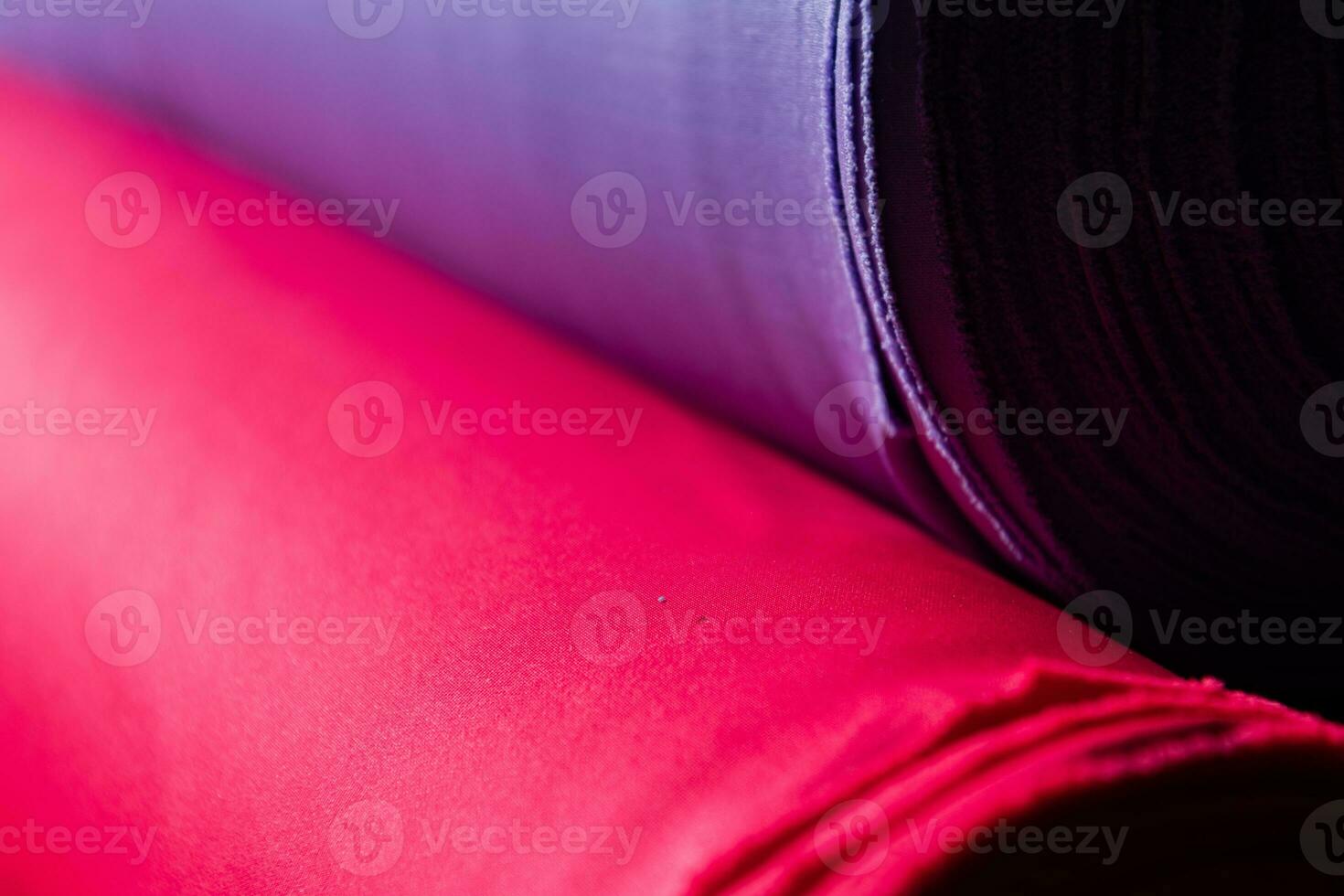 Collection of fashionable fabrics. Samples of different natural fabrics for sewing a fashion collection of clothes. Large selection of fabrics in the store or tailor warehouse. photo